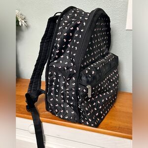 Agatha Paris Black Backpack With Pink Scottie Dog Pattern all over.